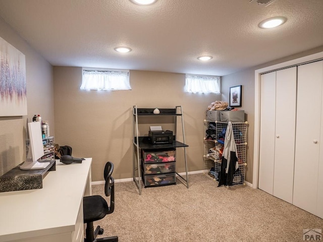 home office featuring light carpet, a textured ceiling, recessed lighting, and baseboards