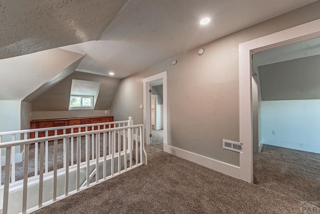 bonus room with vaulted ceiling, visible vents, recessed lighting, and carpet floors