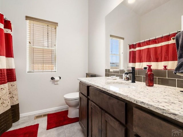 1700 Kingfisher Ln, Pueblo, CO 81008 - full bath with vanity, toilet, tile patterned floors, baseboards, and a shower with curtain