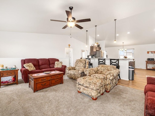 1700 Kingfisher Ln, Pueblo, CO 81008 - living room featuring vaulted ceiling, a ceiling fan, light carpet, and recessed lighting