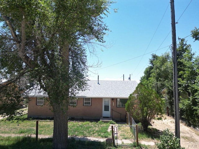 209 Beymer, Cheraw, CO 81030 - view of front facade with a gate and roof with shingles