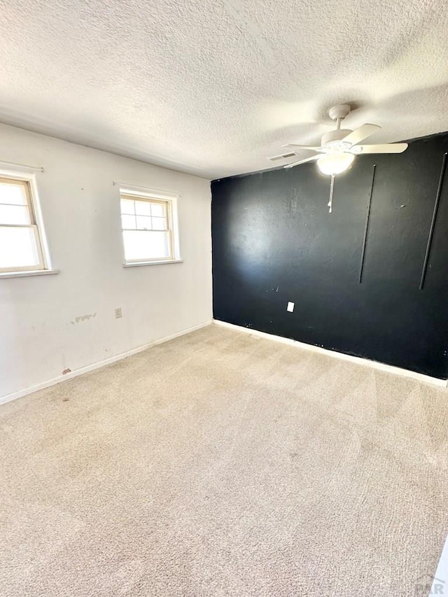 209 Beymer, Cheraw, CO 81030 - empty room with carpet, ceiling fan, and a textured ceiling