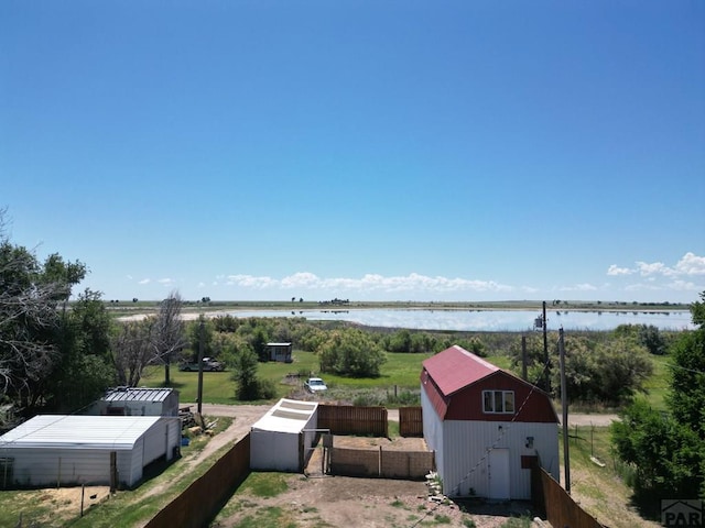 209 Beymer, Cheraw, CO 81030 - view of yard with a water view and a storage shed