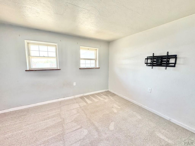 209 Beymer, Cheraw, CO 81030 - carpeted empty room with baseboards and a textured ceiling