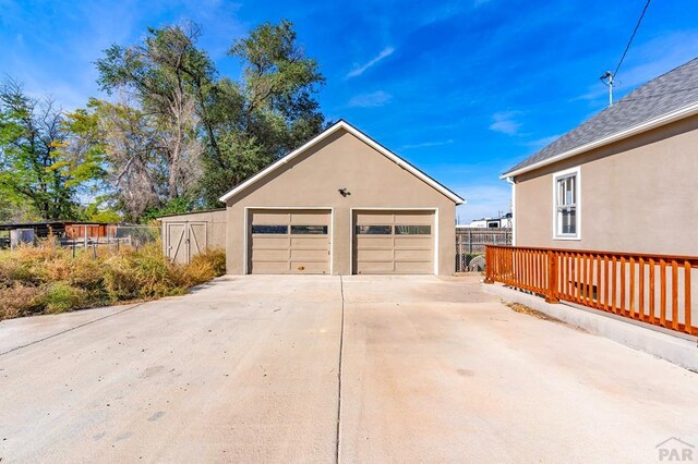 detached garage with fence