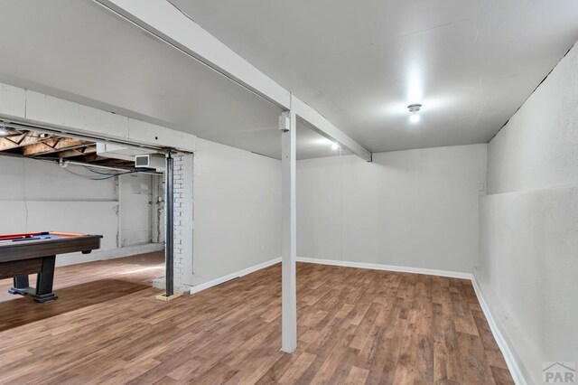 finished basement with billiards, baseboards, and wood finished floors