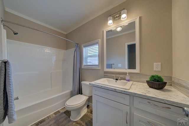 full bath with ornamental molding, vanity, toilet, and shower / bath combo with shower curtain