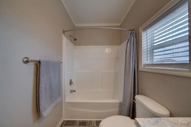 bathroom with toilet and shower / tub combo with curtain