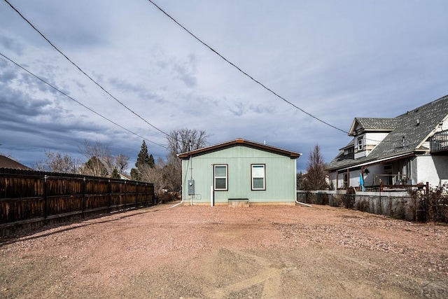 back of property with fence