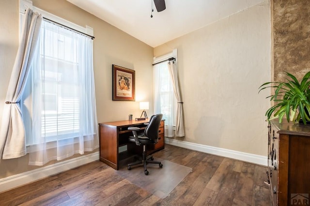 home office featuring a ceiling fan, baseboards, and dark wood-style flooring
