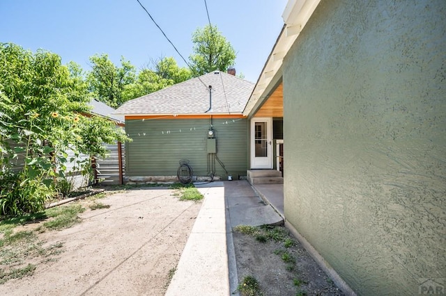 exterior space featuring fence and entry steps
