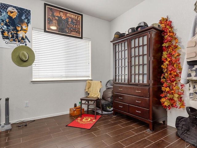 miscellaneous room with wood finish floors and baseboards