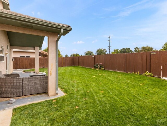 view of yard featuring a fenced backyard