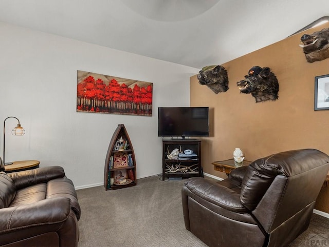 living room featuring carpet flooring and baseboards