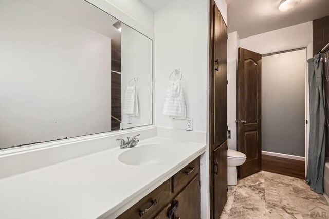 bathroom featuring toilet and vanity