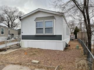 view of side of property with fence