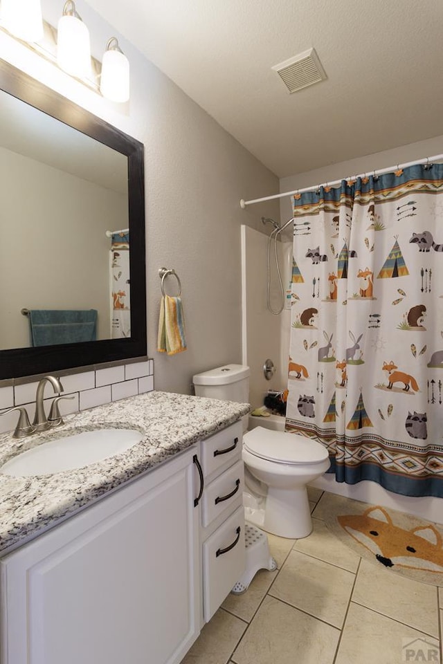 full bathroom with visible vents, toilet, a shower with shower curtain, vanity, and tile patterned flooring