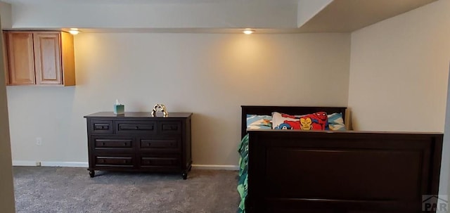 bedroom featuring carpet floors and baseboards