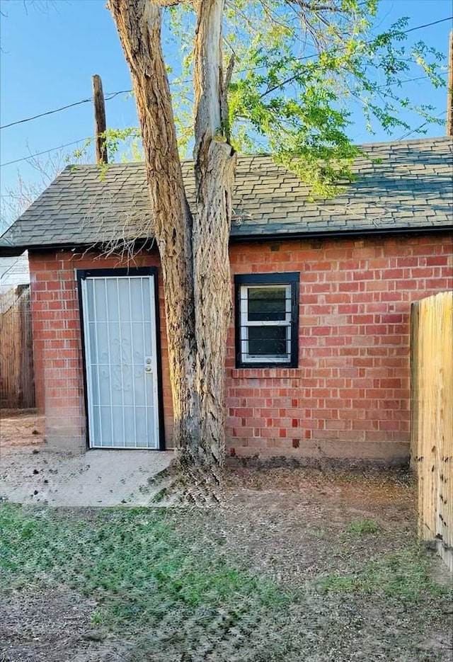 view of outdoor structure featuring fence