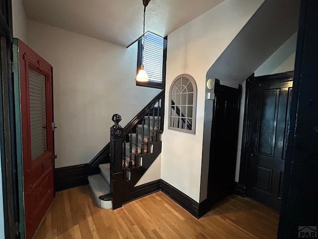 2707 4th Ave, Pueblo, CO 81003 - staircase with baseboards and wood finished floors