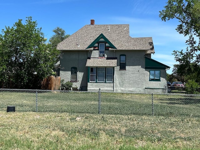 2707 4th Ave, Pueblo, CO 81003 - view of front of home featuring stucco siding, roof with shingles, and a chimney