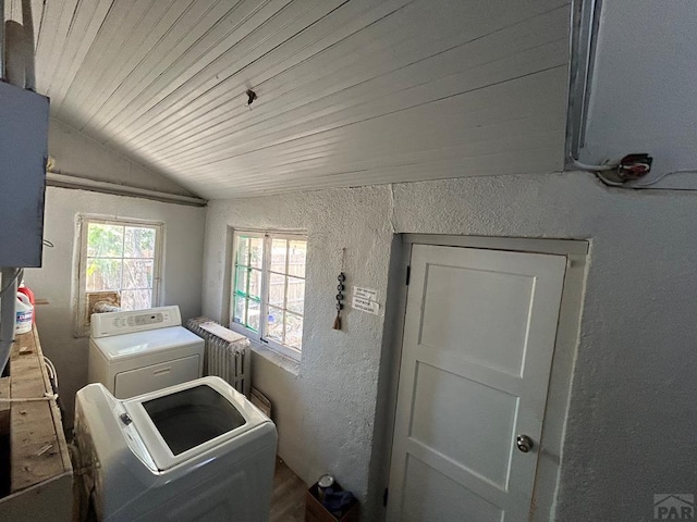 2707 4th Ave, Pueblo, CO 81003 - washroom featuring a textured wall, washer and clothes dryer, and radiator heating unit