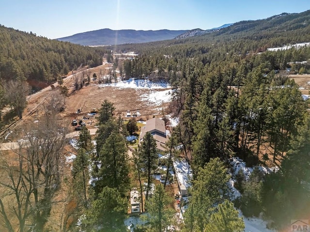 bird's eye view with a mountain view and a wooded view