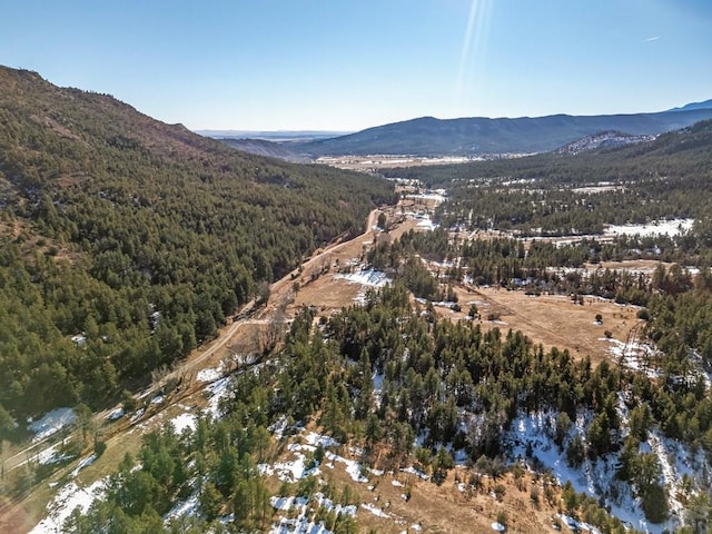 aerial view featuring a water and mountain view