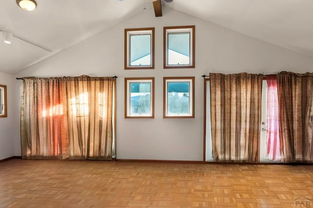 additional living space with high vaulted ceiling and baseboards