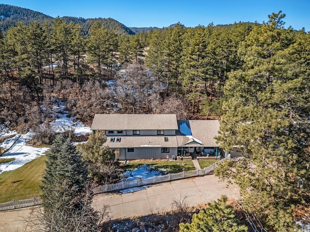 bird's eye view with a forest view and a mountain view