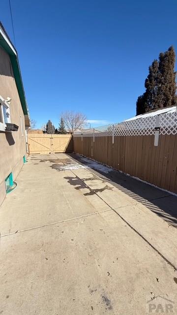 1326 E River St, Pueblo, CO 81001 - view of patio featuring a fenced backyard