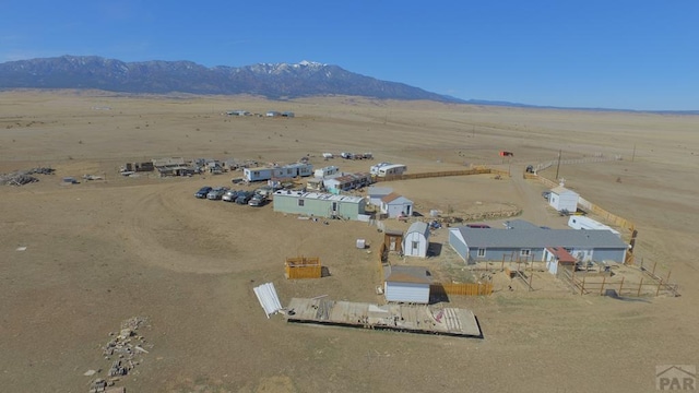 birds eye view of property with a mountain view