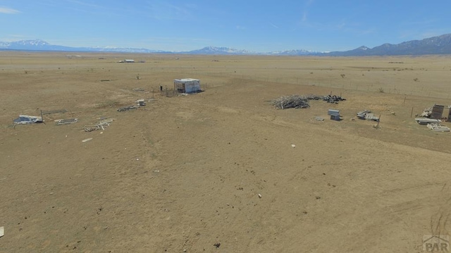 aerial view with a rural view, a mountain view, and view of desert