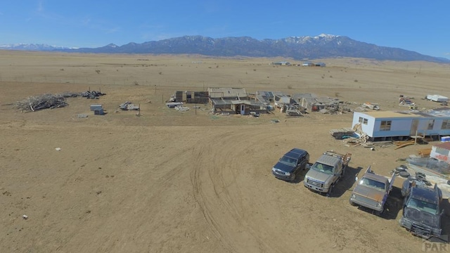 bird's eye view featuring a rural view, a mountain view, and view of desert