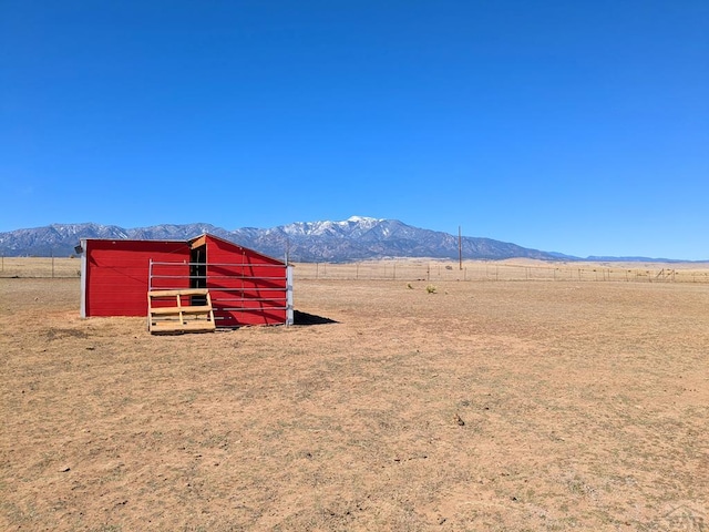 view of mountain feature with a rural view