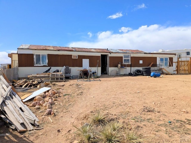 view of front of house featuring an outbuilding and an exterior structure