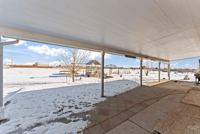 view of snow covered patio