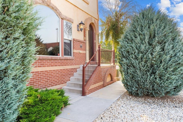 entrance to property with brick siding