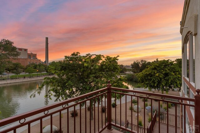 balcony at dusk with a water view