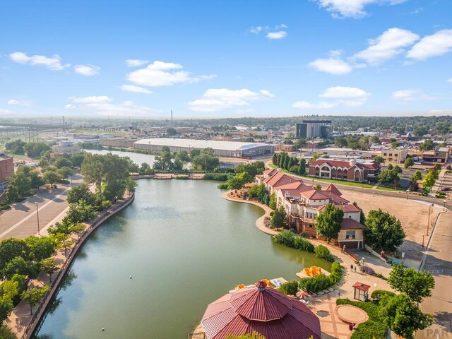 bird's eye view featuring a water view and a residential view