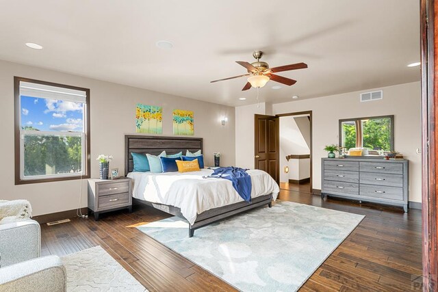 bedroom featuring dark wood-style floors, baseboards, and visible vents