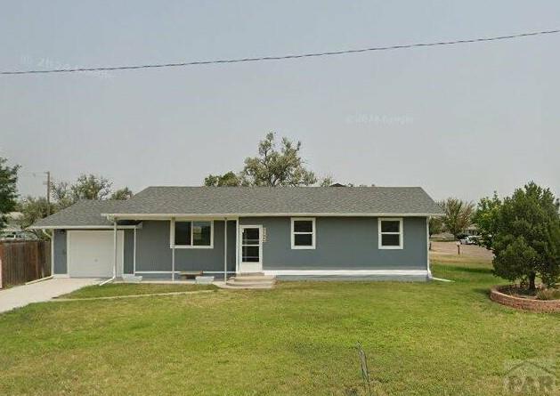1708 W 8th St, Las Animas, CO 81054 - ranch-style home featuring an attached garage and driveway