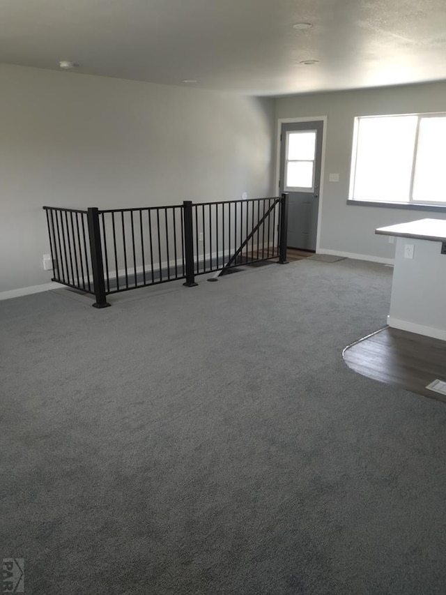 1708 W 8th St, Las Animas, CO 81054 - unfurnished living room with baseboards and carpet floors