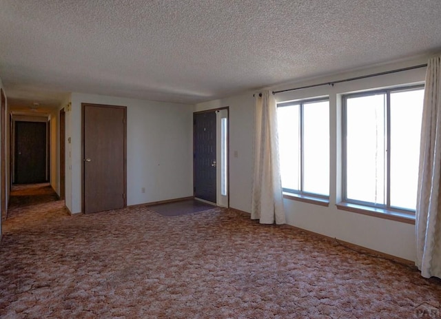 1021 7th St, Walsenburg, CO 81089 - empty room featuring a textured ceiling and carpet flooring