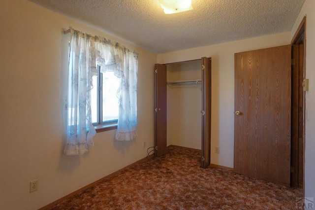 1021 7th St, Walsenburg, CO 81089 - unfurnished bedroom featuring a textured ceiling and carpet flooring