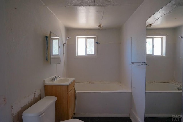 1021 7th St, Walsenburg, CO 81089 - full bath featuring plenty of natural light, vanity, and toilet