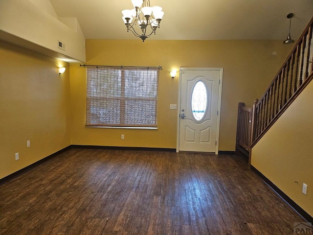 foyer with dark wood-type flooring, visible vents, baseboards, stairway, and an inviting chandelier