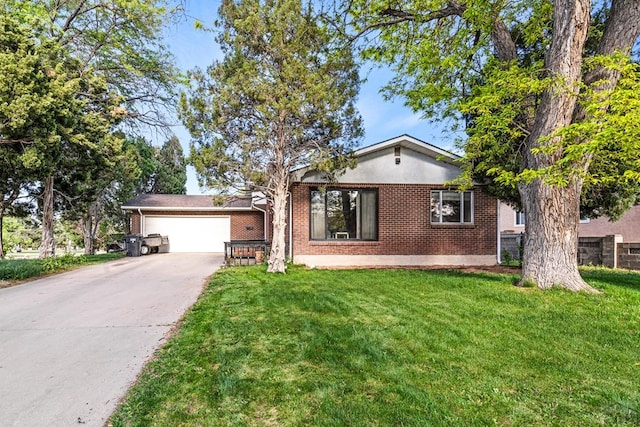 36 Loyola Ln, Pueblo, CO 81005 - view of front of property featuring brick siding, concrete driveway, a front lawn, and a garage