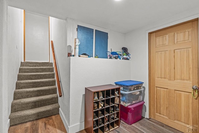 36 Loyola Ln, Pueblo, CO 81005 - stairs featuring wood finished floors and baseboards