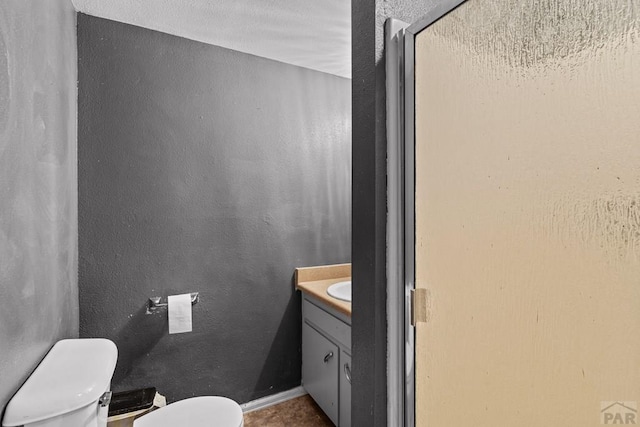 36 Loyola Ln, Pueblo, CO 81005 - bathroom featuring toilet, vanity, and a stall shower